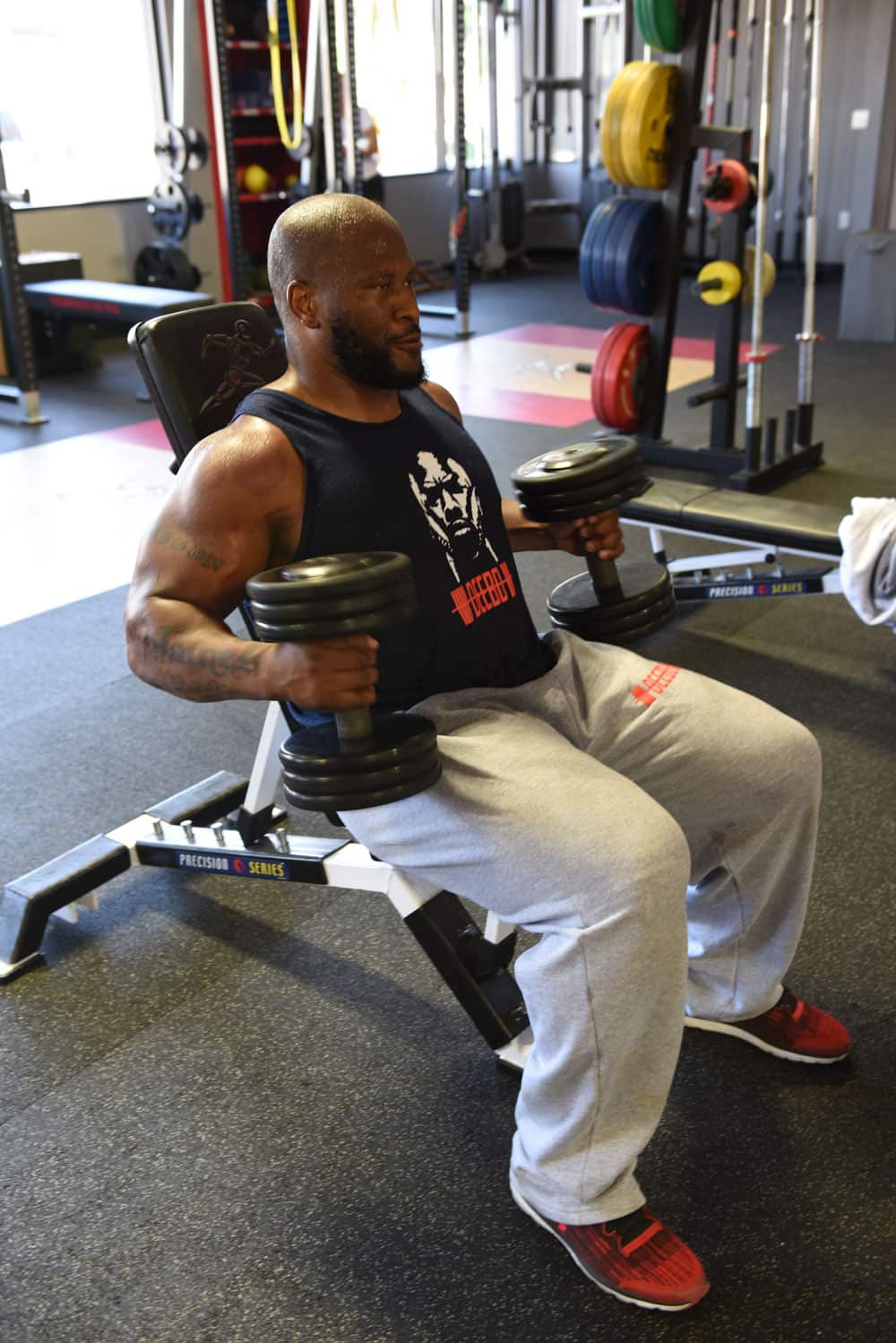 James Harrison lifting weights in the gym.